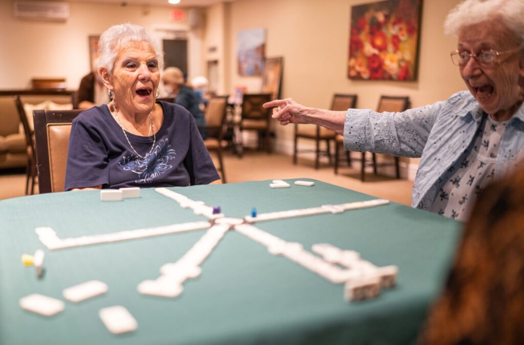 Seniors playing game at retirement living centre in Toronto