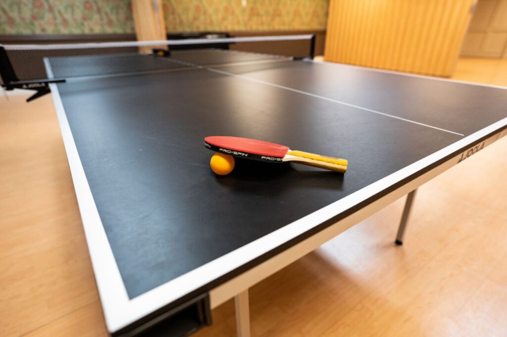 Friendship Room with ping pong table at New Horizons Tower retirement home